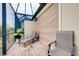 Covered patio with lounge chairs providing relaxation and comfort at 20176 Tesoro Dr, Venice, FL 34293