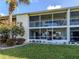 Beautiful condo with a screened lanai overlooking manicured lawn, offering serene outdoor living at 206 Silver Lake Dr # 105, Venice, FL 34292