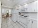 Updated kitchen featuring a dining area with a charming breakfast nook in front of bright bay windows at 206 Silver Lake Dr # 105, Venice, FL 34292