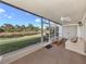 Spacious screened lanai offers tranquil water views and a comfortable seating area, ideal for relaxation at 206 Silver Lake Dr # 105, Venice, FL 34292