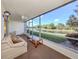 Serene screened lanai offers calming water views, creating a relaxing oasis for enjoying the outdoors at 206 Silver Lake Dr # 105, Venice, FL 34292