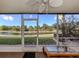 Enjoy this screened lanai with water views, perfect for relaxing or entertaining guests at 206 Silver Lake Dr # 105, Venice, FL 34292