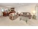 Comfortable living room with a view of dining area and kitchen, perfect for entertaining or relaxing at 206 Silver Lake Dr # 105, Venice, FL 34292