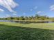 Enjoy the calming water view, with lush green space, creating a serene and inviting atmosphere at 206 Silver Lake Dr # 105, Venice, FL 34292