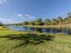 Scenic water view showcases the lush greenery and tranquil lake, providing a peaceful backdrop at 206 Silver Lake Dr # 105, Venice, FL 34292