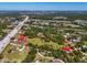 Aerial view of the property showcasing its boundaries, location, and proximity to roads and surrounding landscape at 2211 Englewood Rd, Englewood, FL 34223