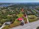 Aerial view of the property showcasing its boundary, location, and proximity to water and amenities at 2211 Englewood Rd, Englewood, FL 34223