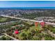 Aerial view of the property showcasing its boundary, location, and proximity to amenities and the coast at 2211 Englewood Rd, Englewood, FL 34223
