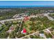 Aerial view of the property highlighting the boundary, location, and proximity to coastal areas at 2211 Englewood Rd, Englewood, FL 34223