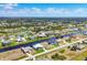Scenic aerial view of waterfront homes, canals, and community landscaping in a desirable residential neighborhood at 226 W Pine Valley Ln, Rotonda West, FL 33947