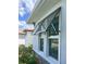 Exterior awning on windows offer shade and complement the home's curb appeal at 226 W Pine Valley Ln, Rotonda West, FL 33947