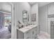 Elegant bathroom with double vanity and marble countertops, plus access to the bedroom and shower at 226 W Pine Valley Ln, Rotonda West, FL 33947