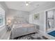 Bright bedroom with stylish decor, patterned bedding, and an en-suite bathroom, creating a cozy retreat at 226 W Pine Valley Ln, Rotonda West, FL 33947
