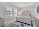 Cozy bedroom with natural light, ceiling fan, and a serene atmosphere at 226 W Pine Valley Ln, Rotonda West, FL 33947