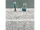Bathroom vanity features a stylish quartz countertop with sea glass decorations at 226 W Pine Valley Ln, Rotonda West, FL 33947