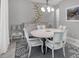 Elegant dining room with a round table, stylish chairs, and decorative lighting at 226 W Pine Valley Ln, Rotonda West, FL 33947
