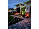 Charming home exterior featuring manicured landscaping, and a paver walkway at 226 W Pine Valley Ln, Rotonda West, FL 33947
