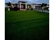 Well-maintained home exterior boasting lush green lawn, landscaping, and modern design at 226 W Pine Valley Ln, Rotonda West, FL 33947