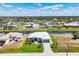 Waterfront home showcases lush lawns and landscaping, canal views, and a charming single-story home at 226 W Pine Valley Ln, Rotonda West, FL 33947