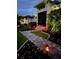 Charming home exterior featuring manicured landscaping, and a paver walkway at 226 W Pine Valley Ln, Rotonda West, FL 33947