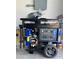 DuroMax XP15000EH generator is situated inside of the garage with a wheel at 226 W Pine Valley Ln, Rotonda West, FL 33947