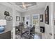 Well-lit home office with a spacious desk, comfortable seating, and modern decor for productivity at 226 W Pine Valley Ln, Rotonda West, FL 33947