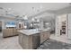 Spacious kitchen with a large island, marble countertops, pendant lights, and modern appliances at 226 W Pine Valley Ln, Rotonda West, FL 33947