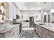 Modern kitchen featuring stainless steel appliances, a large island, and white cabinetry at 226 W Pine Valley Ln, Rotonda West, FL 33947