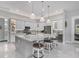 Spacious kitchen with a large island, marble countertops, pendant lights, and modern appliances at 226 W Pine Valley Ln, Rotonda West, FL 33947