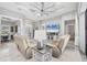 Bright living room featuring reclining sofa set, stylish rug, and television at 226 W Pine Valley Ln, Rotonda West, FL 33947