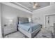 Comfortable main bedroom with tray ceiling, ceiling fan, and ensuite bath at 226 W Pine Valley Ln, Rotonda West, FL 33947