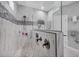 Modern shower with tiled walls, shower head, and built-in storage niche at 226 W Pine Valley Ln, Rotonda West, FL 33947