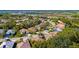 Aerial view of a residential neighborhood featuring well-kept homes with mature trees and landscaping at 2292 Harrier Way, Nokomis, FL 34275
