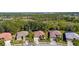 Aerial view of homes nestled amongst lush green trees near community at 2292 Harrier Way, Nokomis, FL 34275