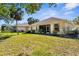 Large backyard featuring lush green grass and screened-in patio with exterior view at 2292 Harrier Way, Nokomis, FL 34275