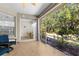 Screened patio offers serene views of the backyard's mature trees and landscaping at 2292 Harrier Way, Nokomis, FL 34275