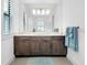Beautiful bathroom with double sink vanity, marble countertop, and stylish blue accent towels at 265 Bocelli Dr, Nokomis, FL 34275