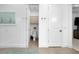 Bright and clean bathroom with a toilet and cabinet visible through a glass shower door at 265 Bocelli Dr, Nokomis, FL 34275