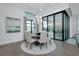 Bright dining area with views of the lanai through large glass doors and windows at 265 Bocelli Dr, Nokomis, FL 34275