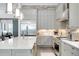 Gourmet kitchen with a central island, stainless steel appliances, and stylish tile backsplash at 265 Bocelli Dr, Nokomis, FL 34275