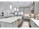 Spacious kitchen with an island, stainless steel appliances, and seamless flow to the living area at 265 Bocelli Dr, Nokomis, FL 34275