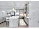 Open-concept kitchen featuring a large island, pendant lighting, and state-of-the-art appliances at 265 Bocelli Dr, Nokomis, FL 34275