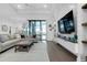 Spacious living room featuring a large sectional sofa, modern decor and lots of natural light at 265 Bocelli Dr, Nokomis, FL 34275