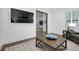 Hardwood floors flow through a view of the Living Room with a decorative coffee table at 265 Bocelli Dr, Nokomis, FL 34275