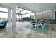 Spacious covered outdoor space with seating, dining area, and a view of the pool at 265 Bocelli Dr, Nokomis, FL 34275