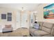 Comfortable living room featuring tile flooring, neutral paint, and an open entryway at 3226 58Th E Ter, Bradenton, FL 34203