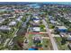 Aerial view of waterfront home with lush landscaping and canal access outlined in red at 328 Channel Ln, Nokomis, FL 34275