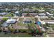 Aerial view of a waterfront home with canal access, showcasing the property's location and surroundings at 328 Channel Ln, Nokomis, FL 34275