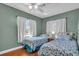 Bedroom features twin beds, natural light and views to the front of the property at 328 Channel Ln, Nokomis, FL 34275