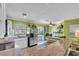 Bright kitchen features granite countertops, stainless steel appliances, and ample storage space at 328 Channel Ln, Nokomis, FL 34275